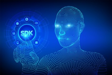 Obraz premium SDK. Software development kit programming language technology concept on virtual screen. Technology Concept. Wireframed cyborg hand touching digital interface. AI. Vector illustration.