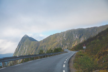 Narrow winding mountain road along the fjord. Senia Island, Norway, Europe