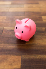 Piggy bank on a wooden surface