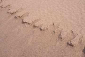 Wet brown sand nature texture background