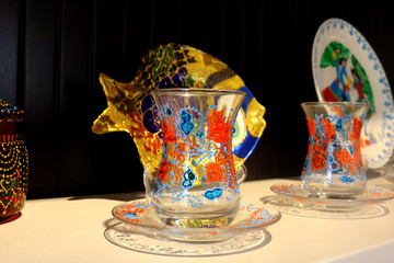 Small tea glass armudu corresponding plate with decoration on it. Turkish Azeri traditional...