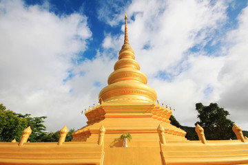 Fototapeta premium Golden pagoda in temple located on the mountain and very beautiful view in Chiangrai Province, Thailand.