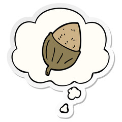 cartoon acorn and thought bubble as a printed sticker