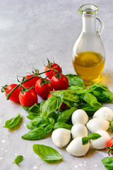  Italian caprese salad ingredients: mozzarella, tomatoes, organic basil and olive oil. recipes italian cuisine
