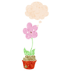 cute cartoon flower and thought bubble in retro textured style
