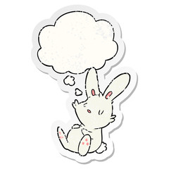 cartoon rabbit sleeping and thought bubble as a distressed worn sticker