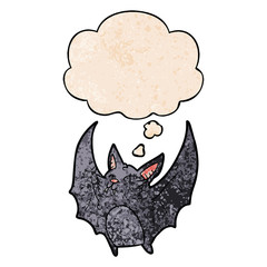 cartoon halloween bat and thought bubble in grunge texture pattern style