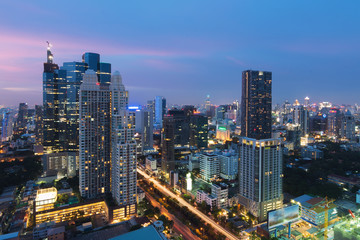 Fototapeta na wymiar Modern building in Bangkok business district at Bangkok city with skyline at twilight, Thailand.