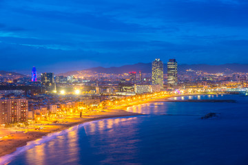 Aerial view of Barcelona Beach in summer night along seaside in Barcelona, Spain. Mediterranean Sea in Spain.