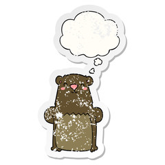 cartoon bear and thought bubble as a distressed worn sticker