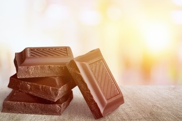 Delicious chocolates isolated on background
