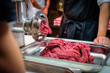 Hamburger meat freshly minced by a meat grinder