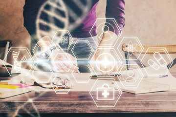 Man's hands working with notes background. Genetic engineering and gene manipulation concept.