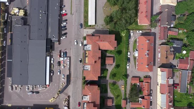 Overhead drone footage showing streets and houses from a residential area in the small mining city of Falun. Filmed in realtime at 4k.