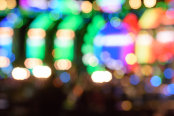 Abstract multi-colored light background with defocused bokeh light. The stage of the entertainment show.