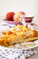 Homemade baked slice fruit berry tart, pie or cake on plate with cotton napkin. Holyday concept