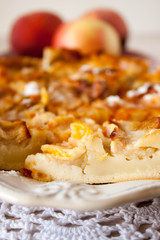 Homemade baked slice fruit berry tart, pie or cake on plate with cotton napkin. Holyday concept