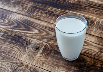 glass of milk on a wooden table