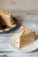 Slice Confectionery Napoleon Cake. Portion of Custard Cream Dessert copy space. Crumbs Around Plate. Bakery Tasty Sweet Dish Closeup