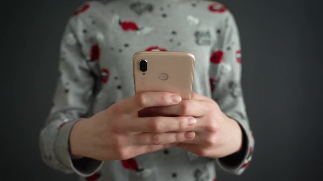 Close up of young teenage girl typing message on smartphone with smartphone text massage animation appearing . Close up female hands. Social network animation. Social media message.