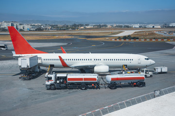 Truck with a tank and a trailer of aviation fuel during the refueling of the aircraft and its...