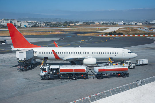 Truck with a tank and a trailer of aviation fuel during the refueling of the aircraft and its service before the flight.