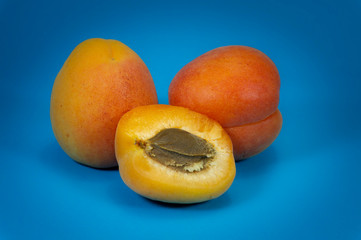 Fresh whole and sliced halved apricots