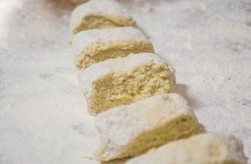 Hands kneading dough for gnocchi.