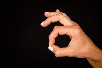 Female hand gesturing ok