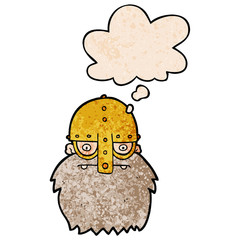 cartoon viking face and thought bubble in grunge texture pattern style