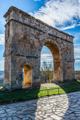 The Arch of Medinaceli is a unique example of monumental Roman triumphal arch within Hispania. Located in Medinaceli, province of Soria, it is the only one of three spans existing in Spain.