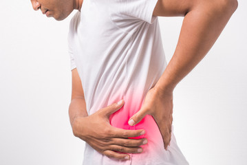 Young man suffering from lumbago