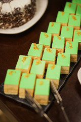 Sweet desserts, pastries on the table during the event. Catering servicing of guests and participants during mass events.