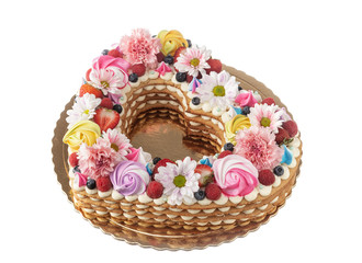 Fototapeta na wymiar Heart shaped puff cake with fruit and flowers.