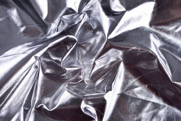 Texture, background, pattern. Cloth with silver metal coating.