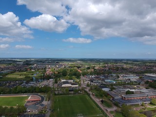Fototapeta na wymiar Drone Aerial view of soccer fields and the buildings of the village of Grootebroek, which is part of urban planning. Photo make with a drone 