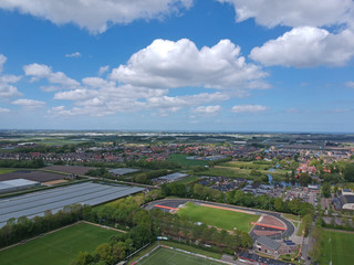  Drone Aerial view of soccer fields and the buildings of the village of Grootebroek, which is part of urban planning. Photo make with a drone 