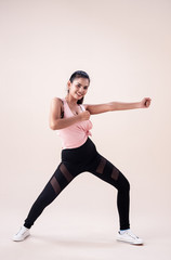 The young woman wearing sportwear, posing Zumba dance workout,basic pattern,for exercise,with smile and happy feeling
