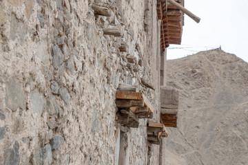 Leh Ladakh city view from Leh Palace on winter. Beautiful amazing village in the valley with snow mountain at background. Ladakh, India.