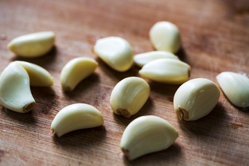 Fototapeta na wymiar Close up of garlic on wooden table.