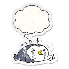 cartoon crying penguin and thought bubble as a distressed worn sticker