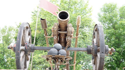 Reconstructed Bronze gun on a wooden carriage with cast-iron cores