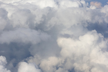 Flying through blue sky with clouds
