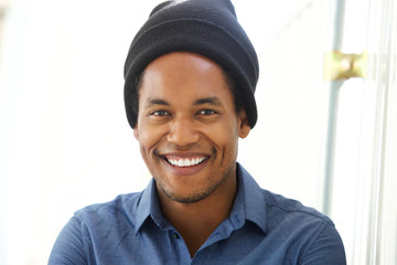 Close up handsome young african american man smiling with beanie