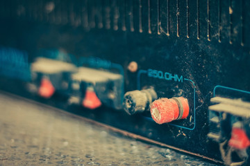 The old amplifiers damaged, placed on the table until the dust was captured.