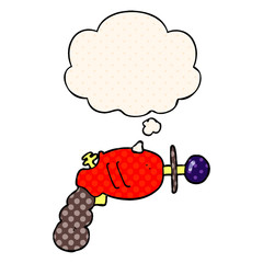 cartoon ray gun and thought bubble in comic book style