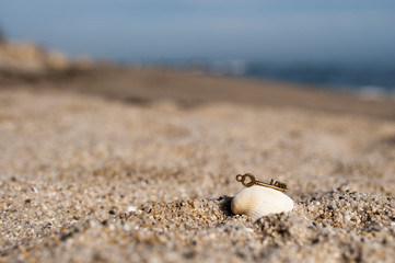 Vintage key love in sand on the beach