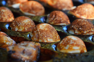 Close up cooking small Dutch traditional pancakes