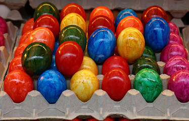 Close up painted Easter eggs in tray carton