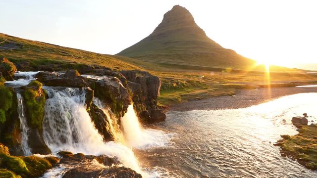 Famous Kirkjufell mountain with cascade waterfalls, Iceland. Kirkjufell is one of the most beautiful natural heritage of Iceland